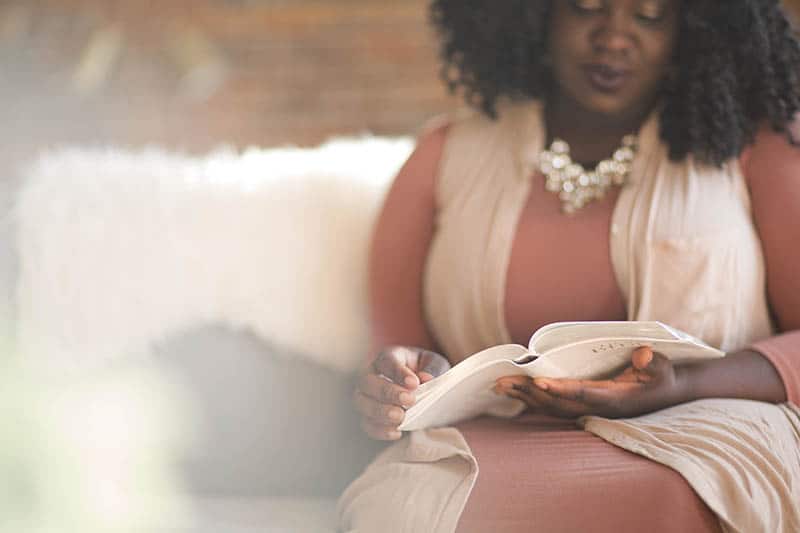 Christian woman studying her Bible | Double your impact this giving season