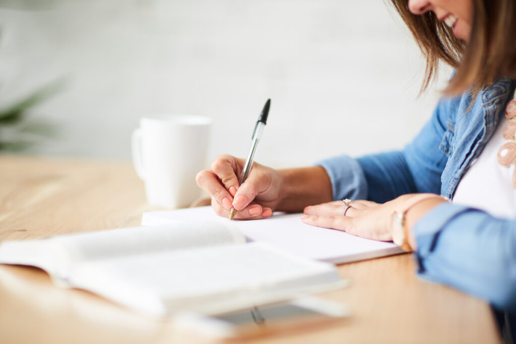 A Christian woman Bible journaling as a way to deepen her relationship with God