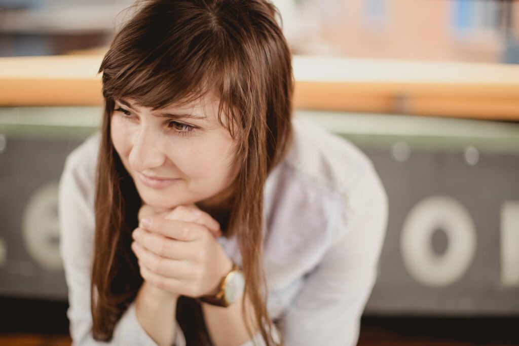 A Christian woman pondering, "Does God really love me?"