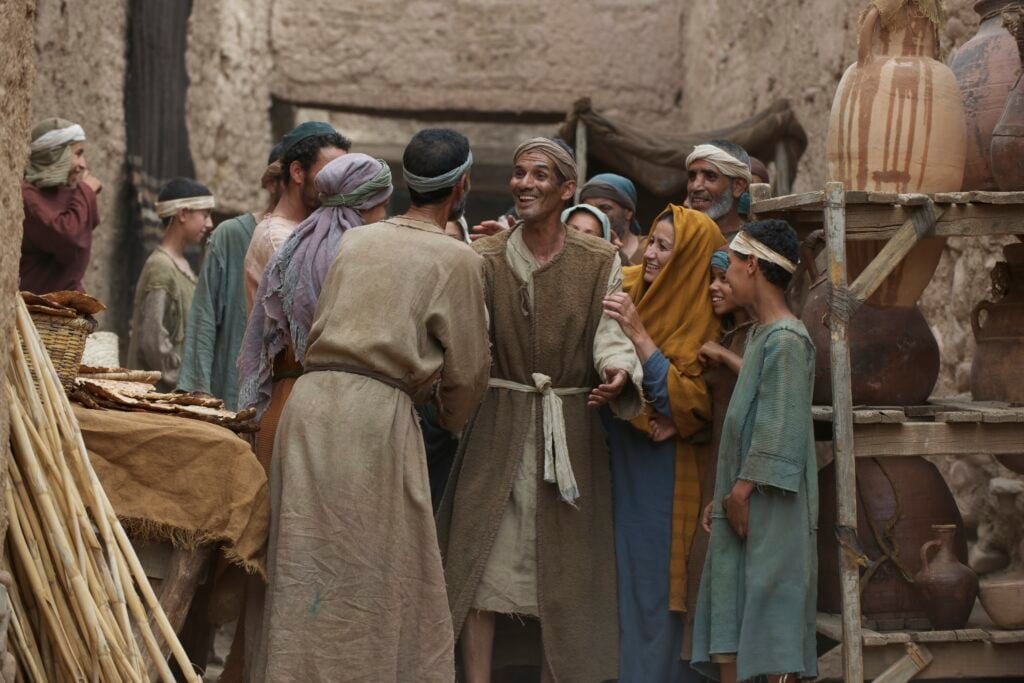 A group of people in ancient Jerusalem, rejoicing together about what God has done