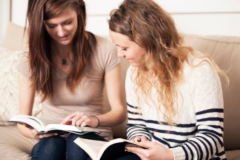 Two Christian women studying the Bible together to learn about kindness and speaking the truth in love