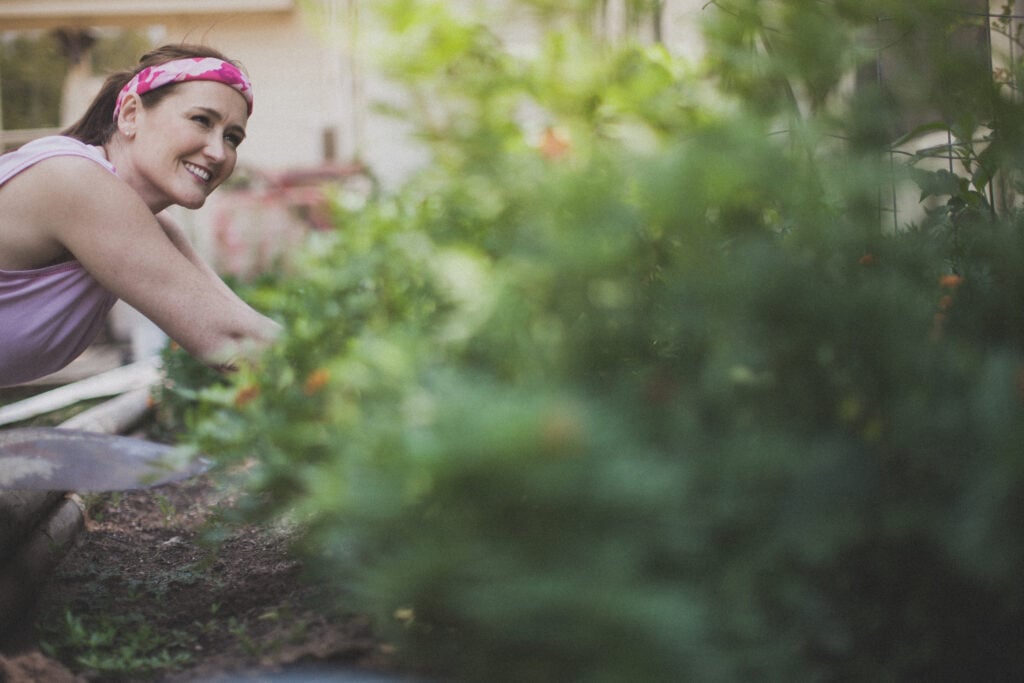 A Christian woman gardening as a symbol of rhythms of grace